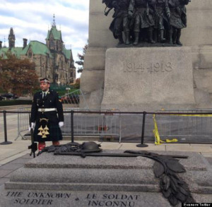 Corporal Nathan Cirillo guarding the War Memorial minutes before he was gunned down (photo Huffington Post)
