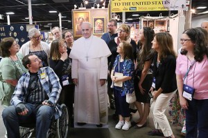CWGLive attendees gather to say goodbye at the CMN Trade Show with Paper Pope Francis